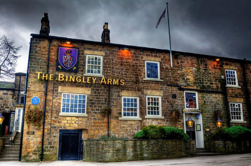 TheBingleyArms's profile picture. Located in the beautiful village of Bardsey, The Bingley Arms is no ordinary pub. It’s the original English pub - officially the oldest in Britain.
