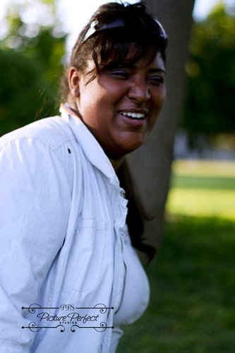 Evita is an experienced hair stylist and the owner of Designs by Evita.