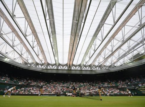 The famous Wimbledon Roof. Open when it's raining, closed when it's sunny - the source of discussion whatever the weather...