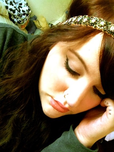 I'm a tattooed, floral print wearing scifi enthusiast with her nose always buried in a book.