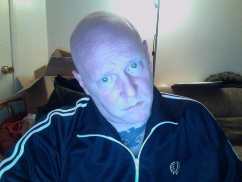 Lead vocals, guitar / guitar synthesizer for Maninblack. Socialist, atheist, Skinhead geezer, Sci-Fi fan, vodka aficionado, Cancer w/ Scorpio rising  - Oi!