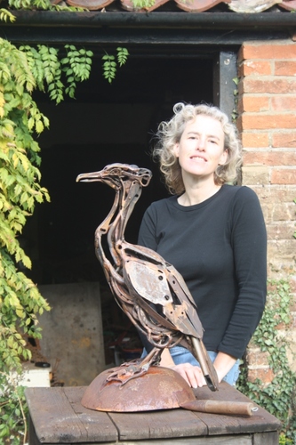 Sculptor. Welder who makes natural history out of agricultural history. Cross between Steptoe and scrap heap challenge.