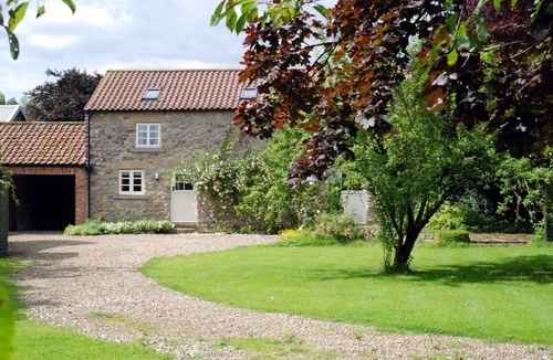 Relax in this fantastic two bedroom holiday cottage on an organic farm in beautiful scenery, near Scarborough, perfect all year. Lawn if sun, log fire if not
