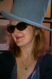 if i had to think of one work it would be eccentric with a hint of ginger, whoops that is more than 1 word!