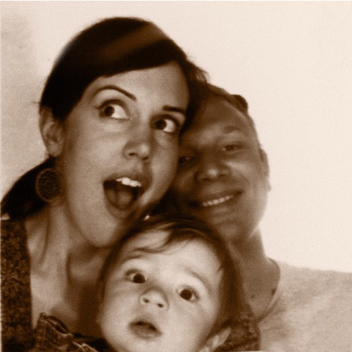 a couple of creative types with two little ones and a cat.