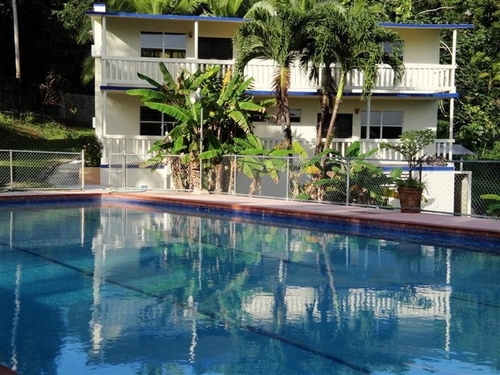 Entrepreneurs & expert vacation adventure travel hosts John & Sara rent studio apartments & pool south of El Yunque in Puerto Rico overlooking the Caribbean Sea