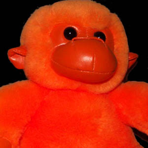 small orange simian