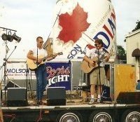 playing guitar around a campfire drinking beer. Country and Classic Rock. listening to 80's music. .