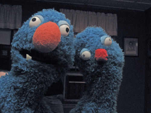 I'm a furry blue monster raised by humans, looking for success as a big time performer.