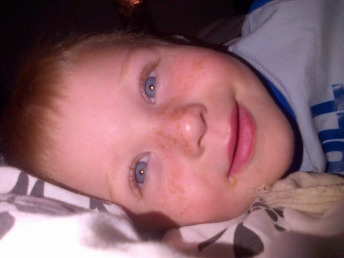 Blue eyes and light brown hair really short and loves a laugh and chat and meeting new ppl .