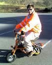 Zingo: the process of a driver on a folding motorbike driving you and your car home safely. 704-804-8000