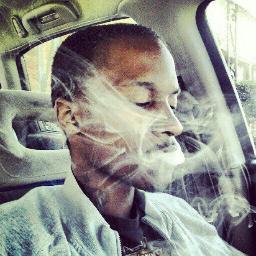A skinny black tatted nigga