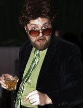 Vaudevillian, impresario, trouser enthusiast.