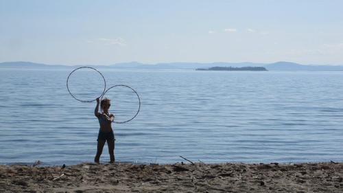 Hula-laa Hooping is a dymanic hoop performance combining hoop dance, acro, and poi style spinning, by Andie.