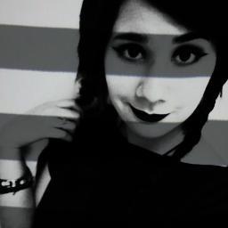 Creepy goth girl who likes heavy metal,bunnies with 2 heads, and to draw people with striped stockings O_O