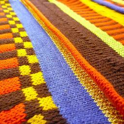 Textile designer - love designing and making fabrics and soft furnishings with a knitting machine or sewing machine...