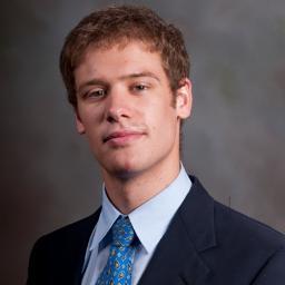 A guy working with people and finance in New York City