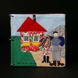 I craft Custom Family Story Books and one of a kind Framed Collages, hand made from vintage fabric and sentimental bits.