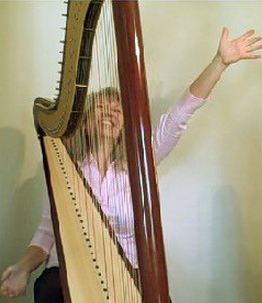 Happy harpist playing all around the Coast!