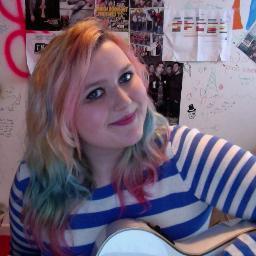 i am a singer/songwriter who plays guitar and has orange hair, most of the time!  and i try to be the most colourful person in the room at all times!