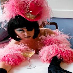 Burlesque Emcee. Schadenfreude personified.