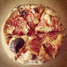 Good people listening to good music celebrating wood-fired pizza.