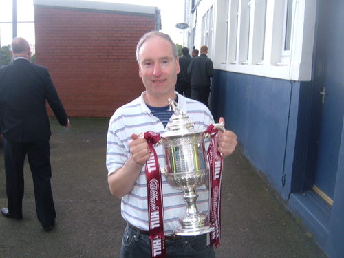 Raith Rovers Programme seller. Picture is of me holding the Scottish Cup, during Laurie Ellis Testimonial versus Hearts.
