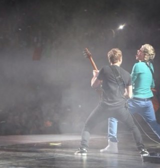 im Niall, im in one direction. i sing and play an instrument with 6 strings on it !