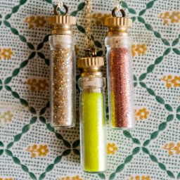 rockvillemonroe's profile picture. Available on Etsy and Shoplately
glass vial necklaces {filled to the brim with gemstones, glitter and vintage gems} vintage inspired pendant necklaces.