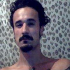 Skater,Philosopher, tattoo artist, pirate, gypsy, latin man laughs Brazil