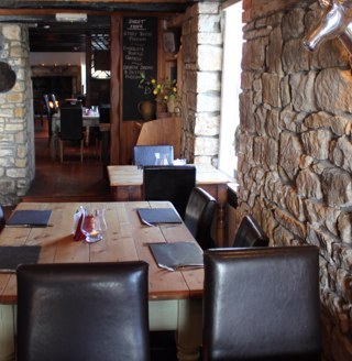Country pub restaurant with real log fires , real ales , extensive wine list , superb home cooked food !!