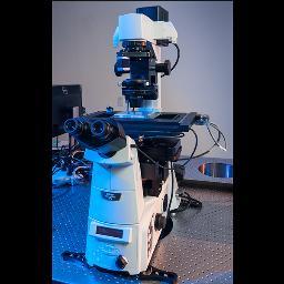 I'm an automated microscope working to understand and find cures for neurodegenerative diseases.