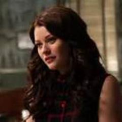 Just a girl whose head is always stuck between the pages of a book. That Regina woman had me locked up, so I have no cursed identity. Just Belle.