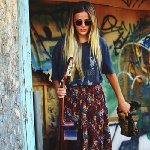 Ravenclaw. 7th year. That weird girl with flowers in her hair.