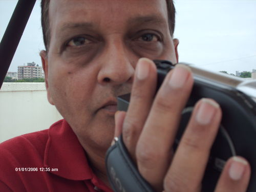 a freelance photographer waiting for an oppur to shoot rural INDIA .