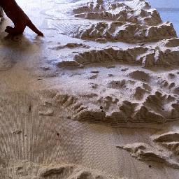 topt4b's profile picture. Featuring the mountains of Vancouver cut into plywood, Topographic Table shakes in response to sensor input and Twitter news about earthquakes in the region.