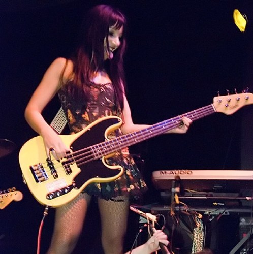I play bass for Girls With Guns.