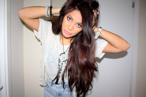 A girl with brown hair. FOLLOW. i don't bite. :)