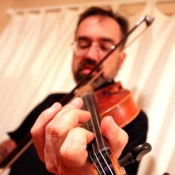 Ian is a professional fiddler and folk singer. He's a father of three and lucky enough to be married to his brilliant musical partner.