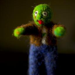 Evil mastermind and needle felter extraordinaire!  Creator of Zombeez Travel Companions- needle felted zombie doll-pins to accompany you on life's adventures!