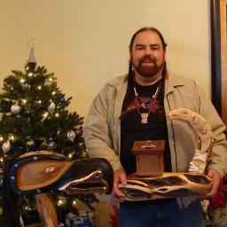 Medicine Bear is Rocky Cree. He was taken in by West Coast Turtle Island family. He carves in many different mediums but mostly works in silver.