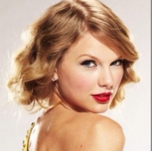 With red lips and cocked hips, Taylor has taken over.