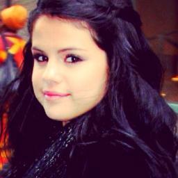 young girl who loves God and Selena Gomez. Love is bigger than anything , for God is love