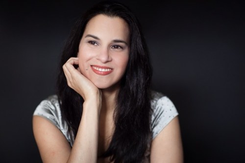 Half-Indian, half-English classical singer who spent her early years in NYC.. talk about multi-cultural.:-)