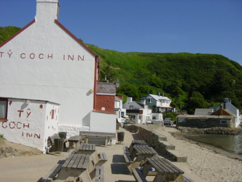 Probably the best pub in the world...
A hidden gem in Wales with a view to die for. 
Grab a pint, sit on the beach and let the world pass by