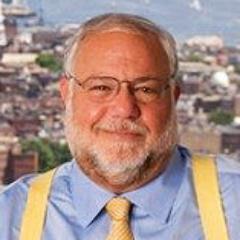 democrat; political communication consultant; college professor; columnist; radio and television analyst