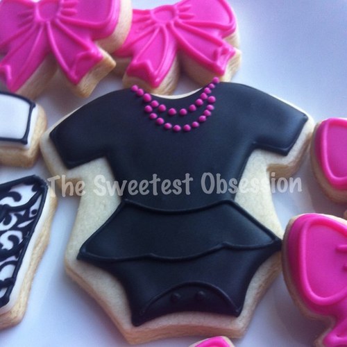 Hand decorated sugar cookies, cake pops, and cupcakes.