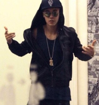 I support and tweet for that beautiful talented Canadian named Justin Drew Bieber .