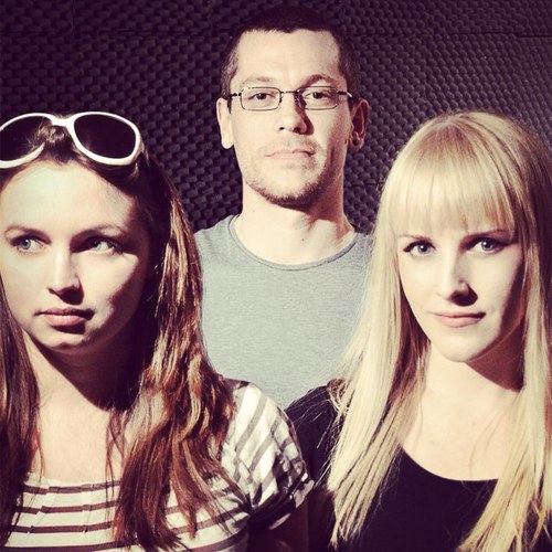 Two girls and one boy making lots of noisy rock music...