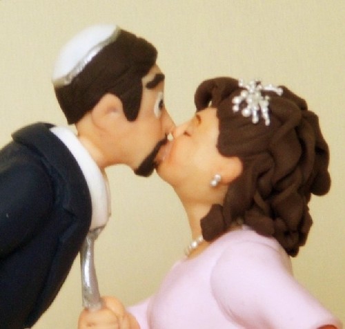 I make custom wedding cake toppers out of polymer clay for people all over the world.  I put my whole self into my work and get carried away with tiny details.